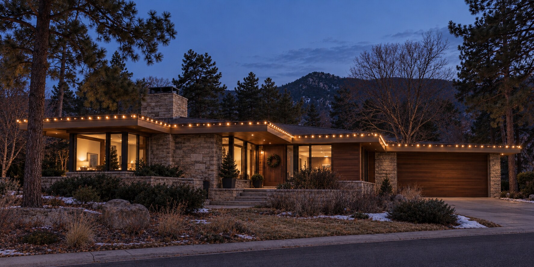 Colorado home with warm white custom-cut roofline Christmas lights